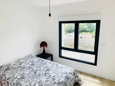 Un ou plusieurs lits dans un hébergement de l'établissement Appartements proches de la mer