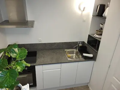 Cuisine ou kitchenette dans l'établissement Duplex Hyper centre-ville 10