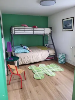 Un ou plusieurs lits dans un hébergement de l'établissement Loue maison Lanvéoc tout confort