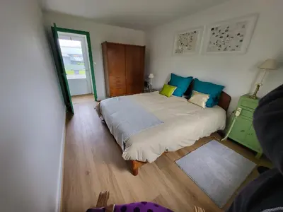 Un ou plusieurs lits dans un hébergement de l'établissement Loue maison Lanvéoc tout confort