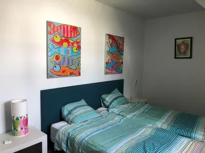 Un ou plusieurs lits dans un hébergement de l'établissement Superbe maison face a l ocean