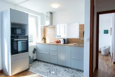 Cuisine ou kitchenette dans l'établissement La Maison Bleue I Belle vue mer et Jardin