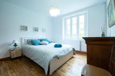 Un ou plusieurs lits dans un hébergement de l'établissement La Maison Bleue I Belle vue mer et Jardin