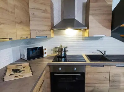 Cuisine ou kitchenette dans l'établissement La pierre du bois