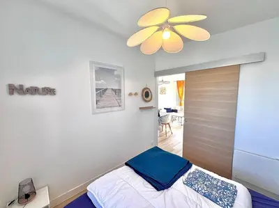 Un ou plusieurs lits dans un hébergement de l'établissement Maison lumineuse à LOCTUDY