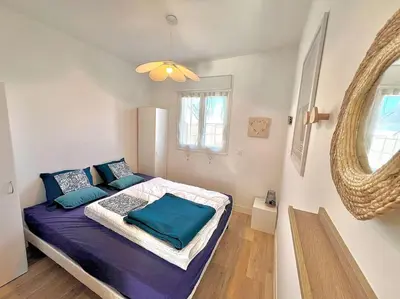 Un ou plusieurs lits dans un hébergement de l'établissement Maison lumineuse à LOCTUDY