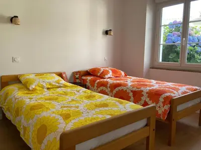 Un ou plusieurs lits dans un hébergement de l'établissement La maison Yvonne - bord de mer - Bénodet