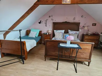 Un ou plusieurs lits dans un hébergement de l'établissement Chambre d'hôte à coté de la voie verte