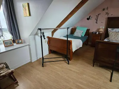 Un ou plusieurs lits dans un hébergement de l'établissement Chambre d'hôte à coté de la voie verte