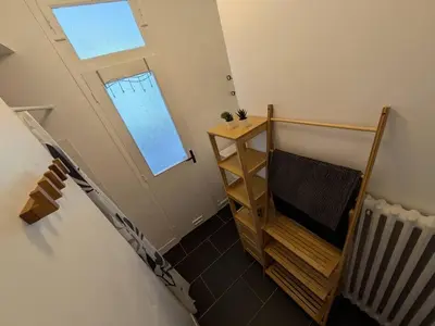 Un ou plusieurs lits dans un hébergement de l'établissement Grand Appartement lumineux