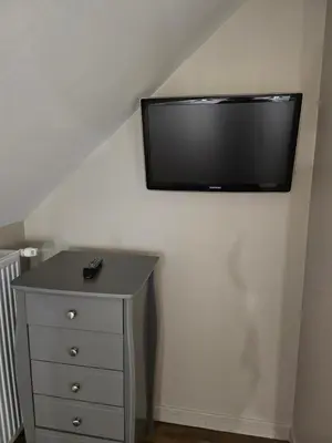 Télévision ou salle de divertissement dans l'établissement Moulin de Kerstrat