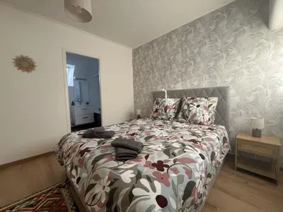 Un ou plusieurs lits dans un hébergement de l'établissement Appartement les Capucins ROSCOFF