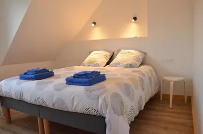 Un ou plusieurs lits dans un hébergement de l'établissement Maison bord de mer - Baie de Douarnenez - Piscine couverte