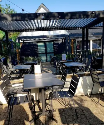 Restaurant ou autre lieu de restauration dans l'établissement Mobilhome 3 chambres TV-WIFI-Lave-linge