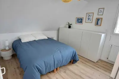 Un ou plusieurs lits dans un hébergement de l'établissement Petite maison de bord de mer