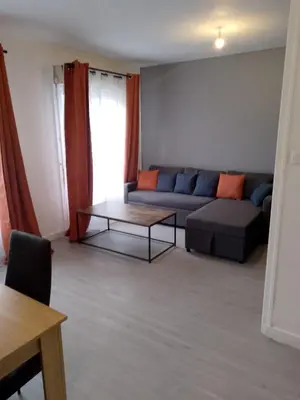 Coin salon dans l'établissement Appartement avec 2 chambres Morlaix et internet