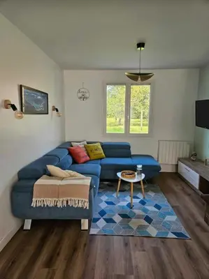 Coin salon dans l'établissement Maison familiale Les 3 commères