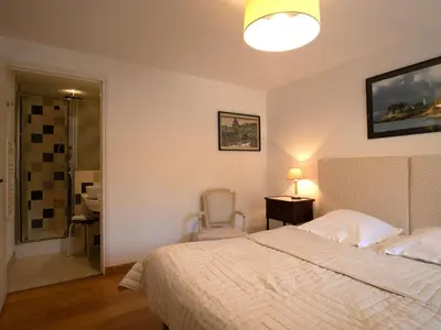 Un ou plusieurs lits dans un hébergement de l'établissement Apartment La Manoir du Moros by Interhome