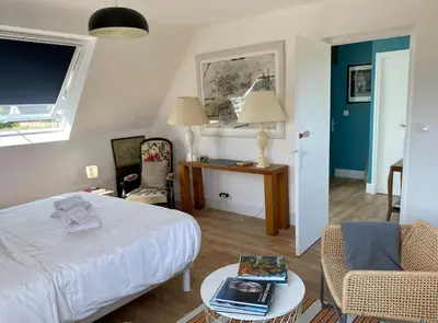 Un ou plusieurs lits dans un hébergement de l'établissement VILLA DU BILLOU Repos et plaisirs de la mer
