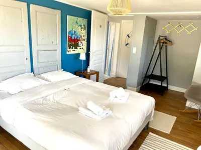 Un ou plusieurs lits dans un hébergement de l'établissement VILLA DU BILLOU Repos et plaisirs de la mer