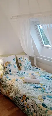 Un ou plusieurs lits dans un hébergement de l'établissement Petite chambre dans maison individuelle