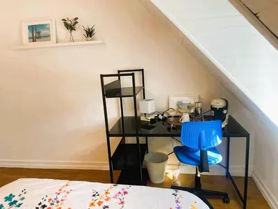 Un ou plusieurs lits dans un hébergement de l'établissement Chambre dans maison individuelle