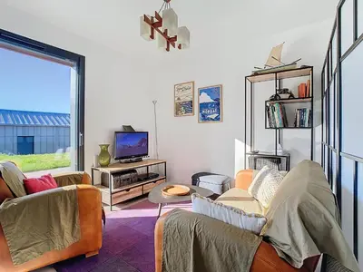 Télévision ou salle de divertissement dans l'établissement Maison La Caravelle à Crozon