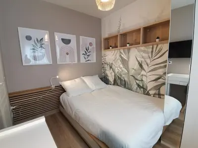 Un ou plusieurs lits dans un hébergement de l'établissement Studio cosy et calme