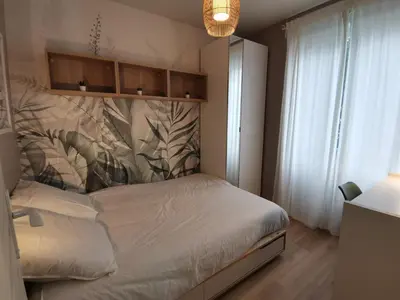 Un ou plusieurs lits dans un hébergement de l'établissement Studio cosy et calme
