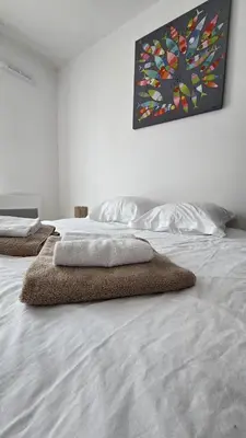 Un ou plusieurs lits dans un hébergement de l'établissement Vacances Ô Kastel - Studio Centre Ville proche de la mer