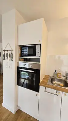 Cuisine ou kitchenette dans l'établissement Vacances Ô Kastel - Studio Centre Ville proche de la mer