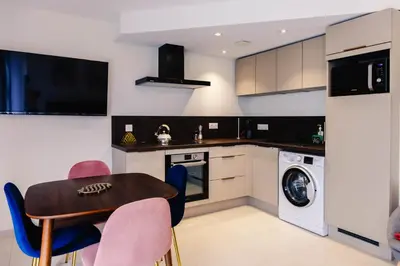 Cuisine ou kitchenette dans l'établissement Au jardin Ginkgo