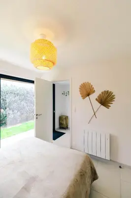 Un ou plusieurs lits dans un hébergement de l'établissement Au jardin Ginkgo