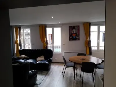 Coin salon dans l'établissement Un Appartement tout à vous