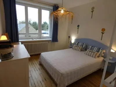 Un ou plusieurs lits dans un hébergement de l'établissement appartement fleurs