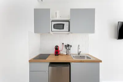Cuisine ou kitchenette dans l'établissement STUDIOS cosy au centre-ville quartier Jaurès et Saint-Martin