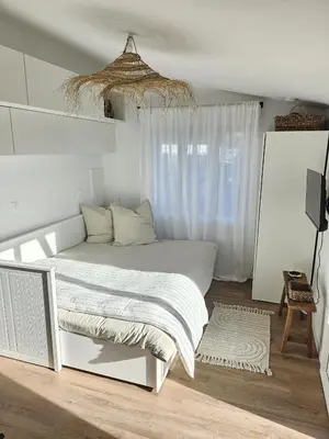 Un ou plusieurs lits dans un hébergement de l'établissement Studio Le Petit Sablé