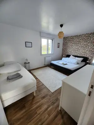 Un ou plusieurs lits dans un hébergement de l'établissement Ti an holen Maison familiale de charme à 5mn à pied de la plage et du port