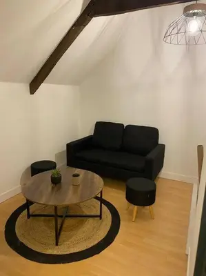 Coin salon dans l'établissement L'appartement du Conte Even
