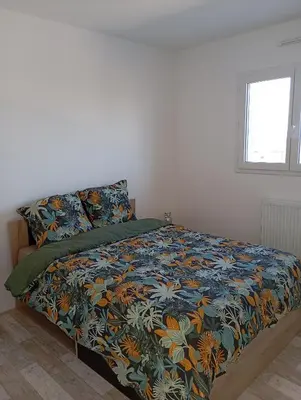 Un ou plusieurs lits dans un hébergement de l'établissement Gîte à 400m de la mer