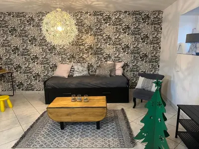 Coin salon dans l'établissement Petite maison sur ferme 5min de la plage idéal professionnel