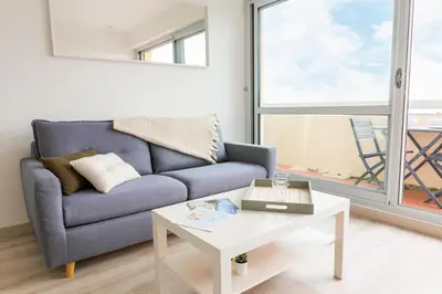 Coin salon dans l'établissement Appartement pour 4 avec vue sur mer, Benodet