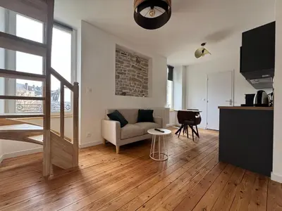 Coin salon dans l'établissement Résidence des Quais - Centre ville - Wifi - Netflix