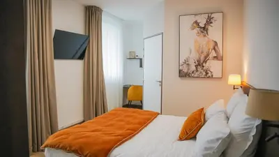 Un ou plusieurs lits dans un hébergement de l'établissement KoonTy - Chambres et Appartements à Landerneau