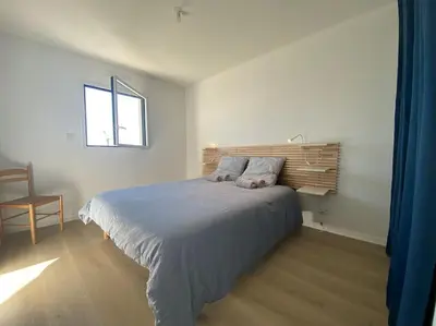 Un ou plusieurs lits dans un hébergement de l'établissement Maison neuve vue panoramique sur la mer 6 pers à Crozon