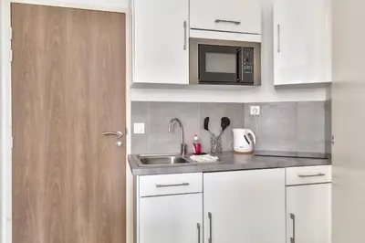 Cuisine ou kitchenette dans l'établissement STUDIOS cosy Quartier Harteloire proche centre-ville