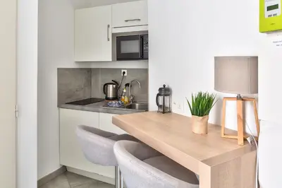 Cuisine ou kitchenette dans l'établissement STUDIOS cosy Quartier Harteloire proche centre-ville