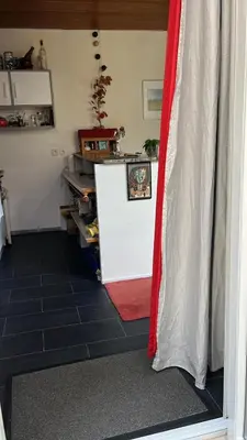 Cuisine ou kitchenette dans l'établissement Cosy House