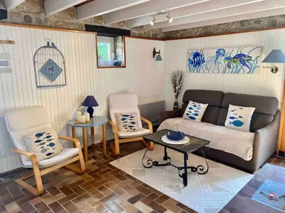 Coin salon dans l'établissement Gîte Breizh piscine ou jacuzzi