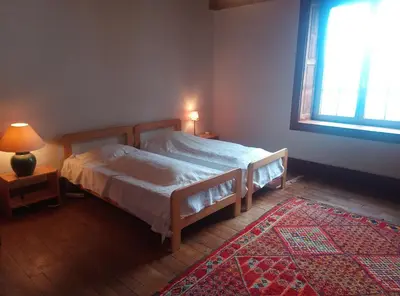 Un ou plusieurs lits dans un hébergement de l'établissement Ar Maner - Grande maison familiale - 7 chambres - Jardin